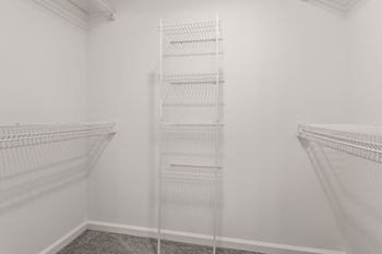 A room with two white closets and a white wall